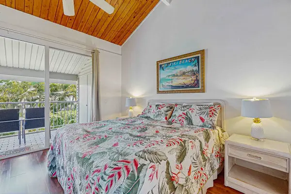 Master bedroom with king bed and lanai access.