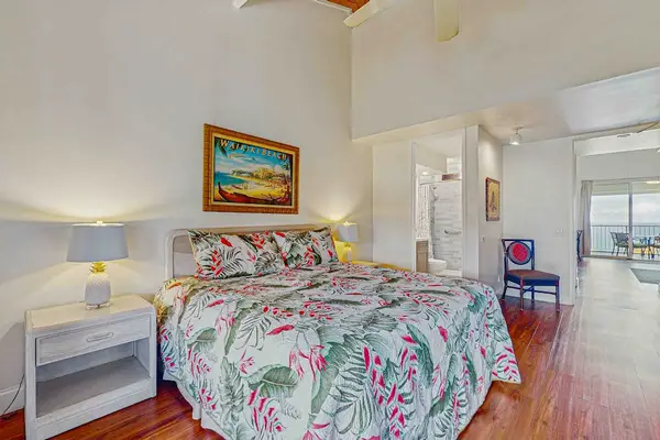 Master bedroom with king bed and lanai access.
