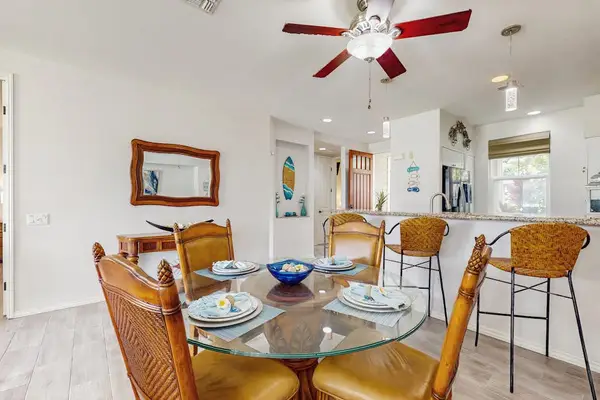 Sunlit Dining Space With Easy Kitchen Access