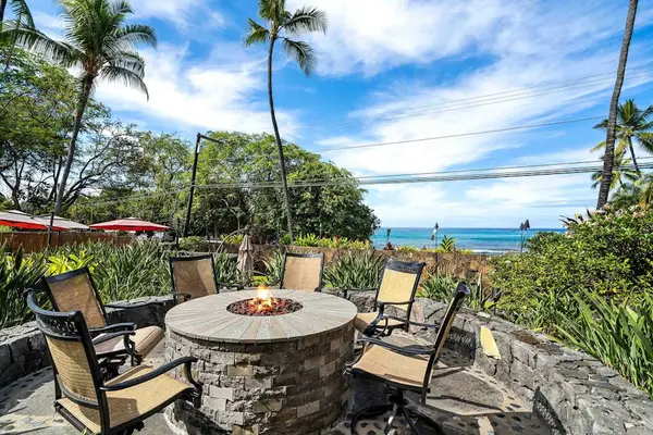 Outdoor stone fire pit seating area