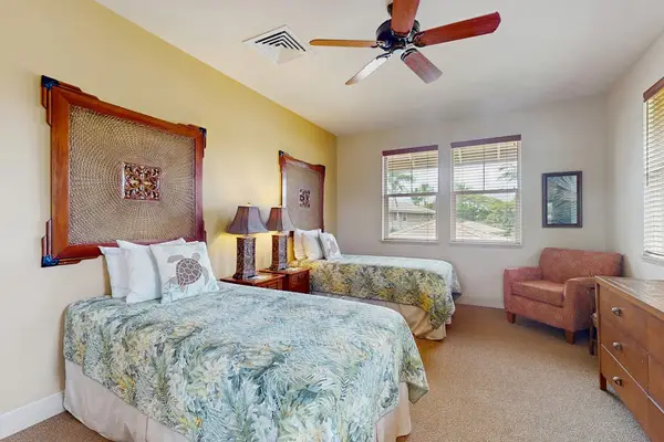 Guest Bedroom featuring Two Twin Beds with Tropical Headboards