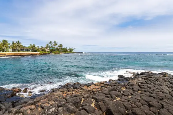Volcanic Coast With Endless Blue Waters