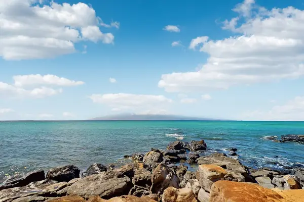 Rocky Shoreline And Blue Waters
