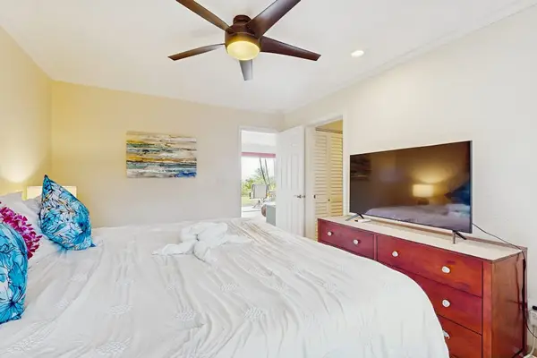 Sunlit sleeping space features coordinated furnishings, calming colors, and comfort