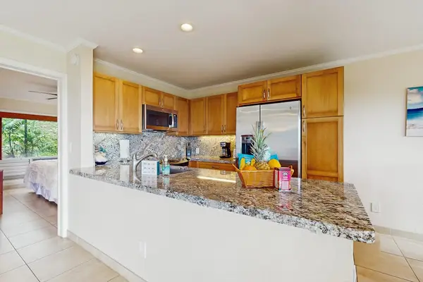 Contemporary cooking space provides practical storage, preparation surfaces, and fixtures