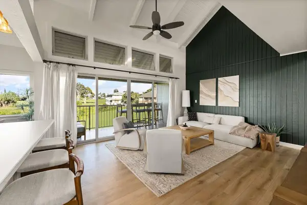 Living room overlooking lush tropical greenery