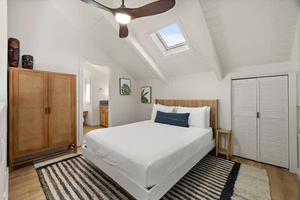 Modern loft bedroom with warm wood accents