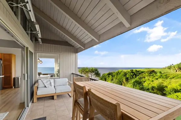 Oceanview lanai dining area overlooking the coastline