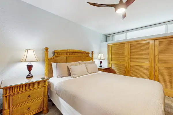 Comfortable bedroom with a king bed and flat-screen TV for restful nights and relaxing mornings.