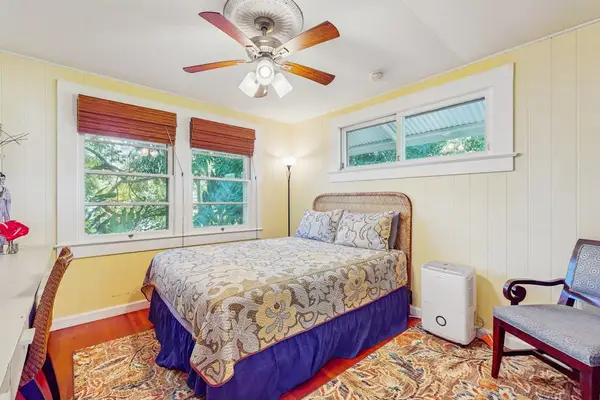 Sunny Guest Bedroom With Tropical Views