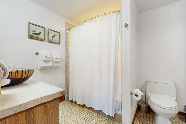 Bright Full Bathroom With Shower Tub Combo