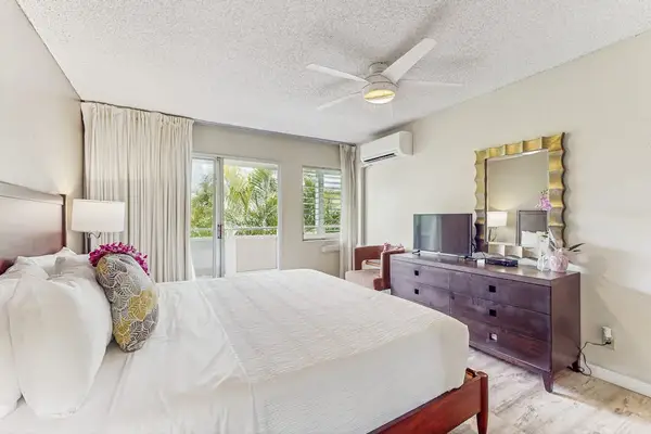 Newly remodeled condo with king bed, ceiling fan and light from the lanai.  There is a flat screen tv while you unwind.