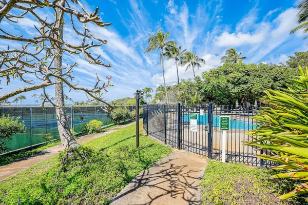 Garden paths leading to resort amenities and ocean views