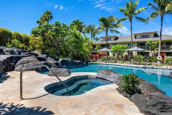 Peaceful spa and pool surrounded by palms