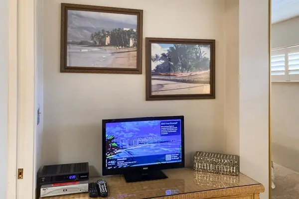 King bedroom with TV and dresser for added comfort