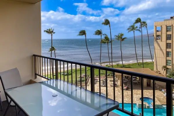 Private lanai with sweeping ocean and pool views
