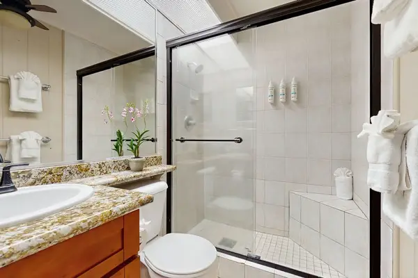 Spacious Bathroom With Walk-In Glass Shower