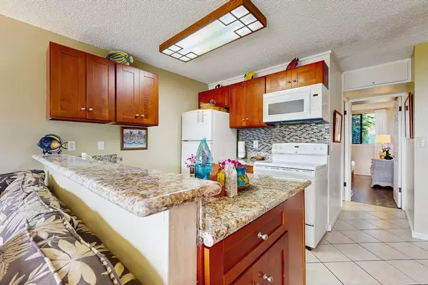 Bright Coastal Kitchen With Breakfast Bar