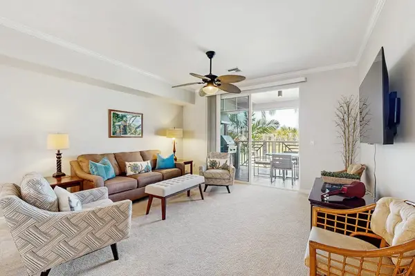 Bright living room with lanai access