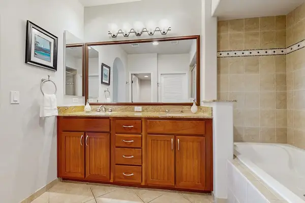 Bathroom with a soaking tub and spacious vanity