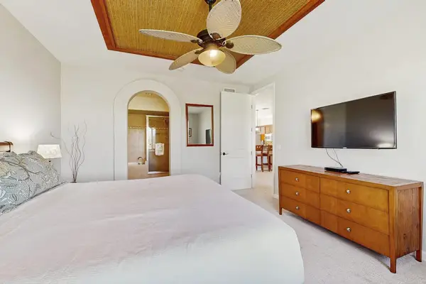 Bright primary bedroom with island-inspired décor