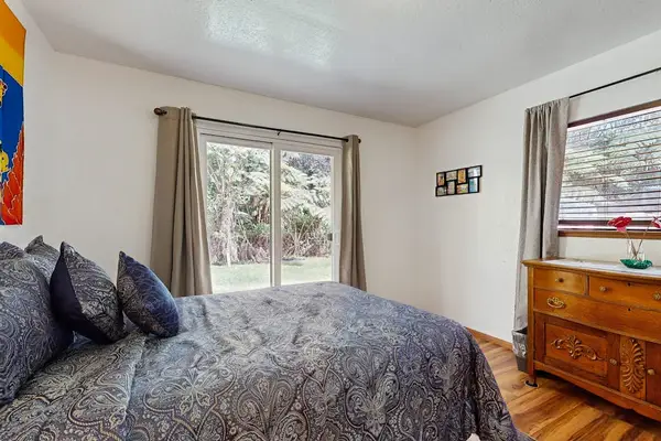 Cozy Bed with Sliding Glass Door Lawn Access