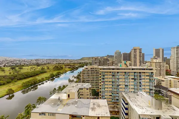 Relax on the pool deck while enjoying the beautiful view beyond the water.