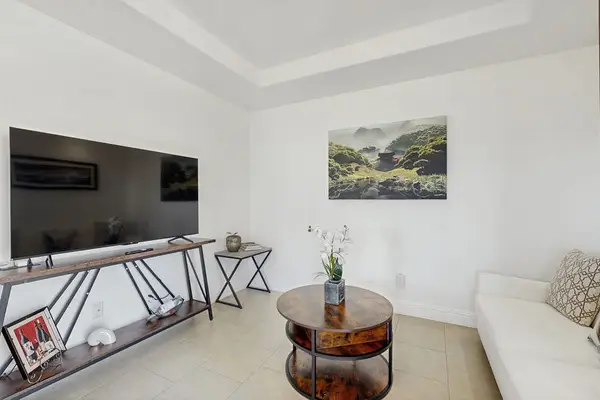 Living room with sofa bed and flat screen tv.