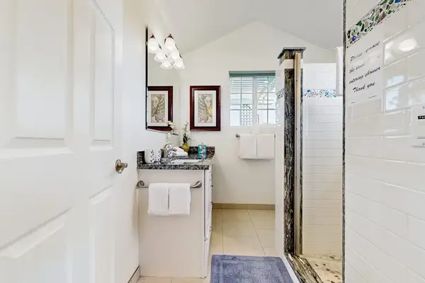 Master bathroom with large tiled walk-in shower.