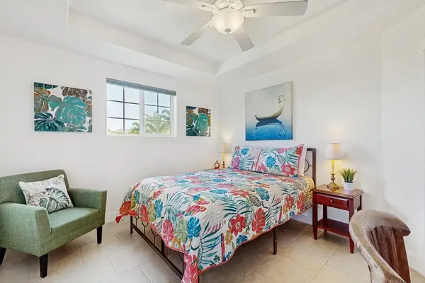 Master bedroom with queen bed and flat screen tv.