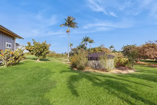 This exquisite one-bedroom apartment is nestled within a peaceful five-acre botanical estate, offering a serene retreat.