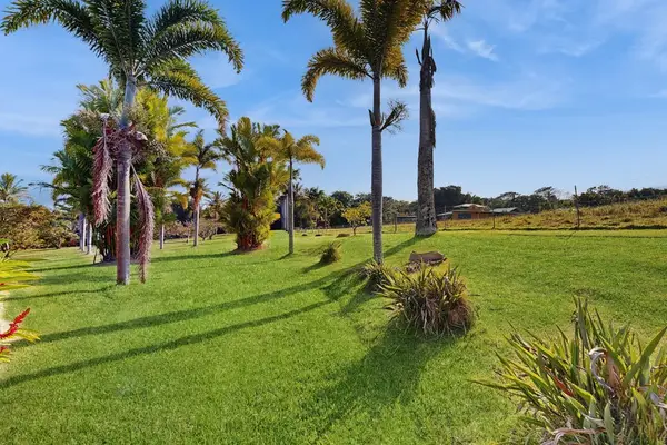 This exquisite one-bedroom apartment is nestled within a peaceful five-acre botanical estate, offering a serene retreat.