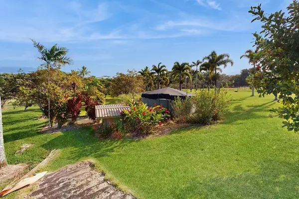 This exquisite one-bedroom apartment is nestled within a peaceful five-acre botanical estate, offering a serene retreat.