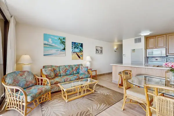 Living room with sleeper sofa and flat screen tv.  Views of the turquoise waters from comfort of your couch.