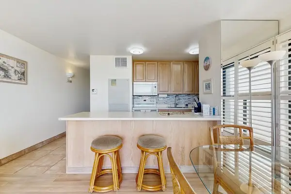 Barstools at the kitchen for extra seating.