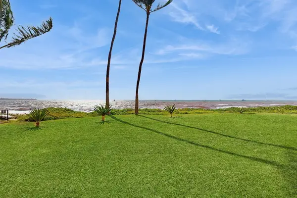 Stroll through the grounds through Sugar Beach Resort and take in the tropical views.