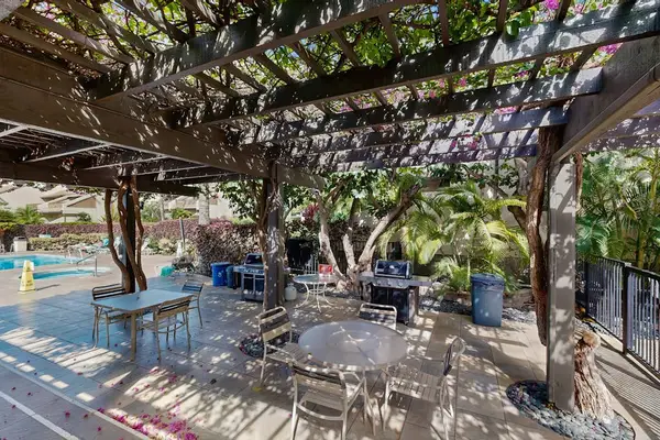 Shaded poolside patio for outdoor gatherings
