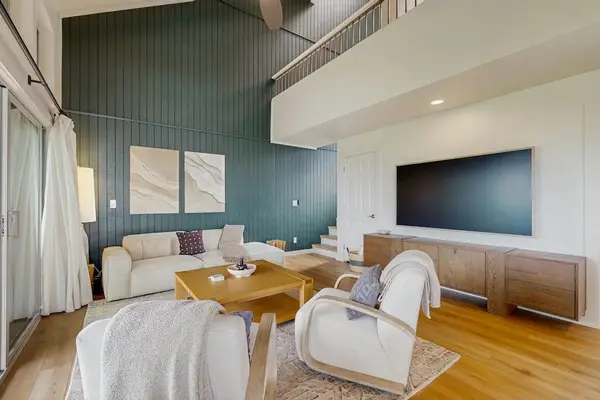 Spacious living room with a cozy seating area