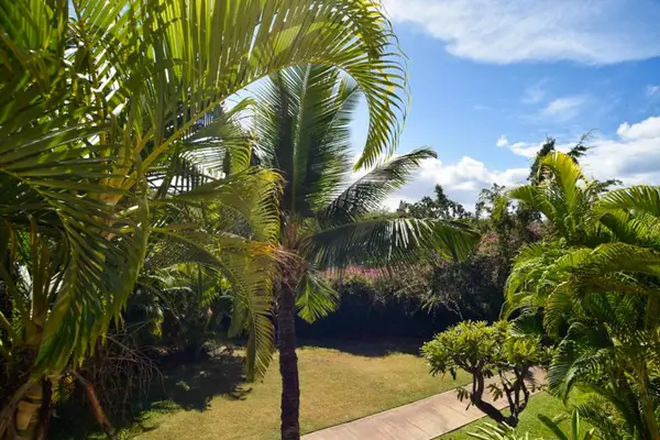 Stroll through beautifully landscaped tropical resort grounds