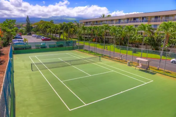 Spacious tennis courts ready for a friendly game