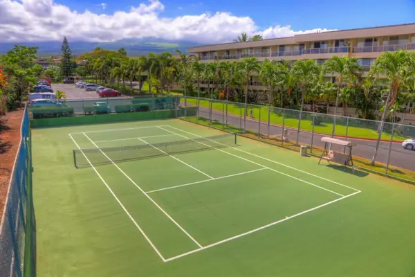 Spacious tennis courts surrounded by beautiful island scenery