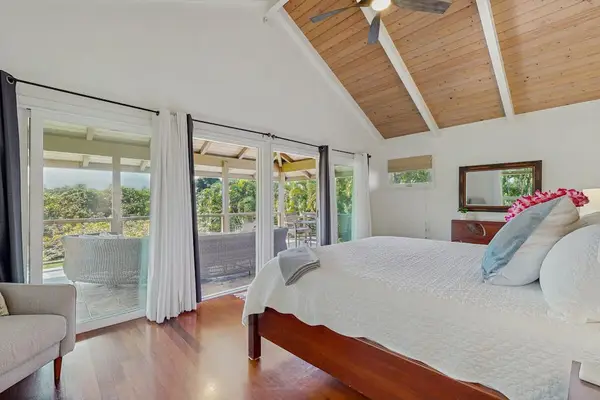 Master bedroom with King Bed, en suite bath and mountain views with private access to upper balcony.