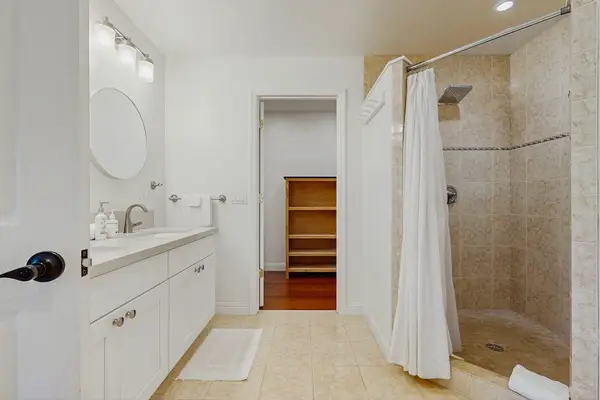 Full bathroom with walk in tile shower