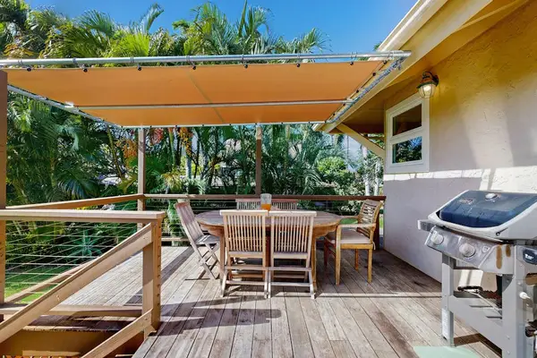 One of two decks - relax out of the sun and grill for the family while watching the children play in the large backyard.