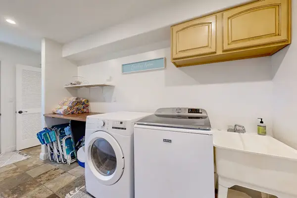 The in-home washer and dryer make family stays easy and convenient along with seven beach chairs, beach towels, water sports gear, and a beach umbrella are available for guest use.
