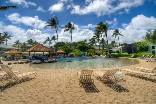 Lush Tropical Gardens Framing The Resort Pool