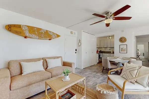 Sink into the comfy couch and relax in the welcoming living room.