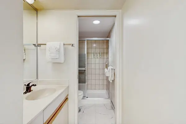 Clean bathroom with a practical shower and tub