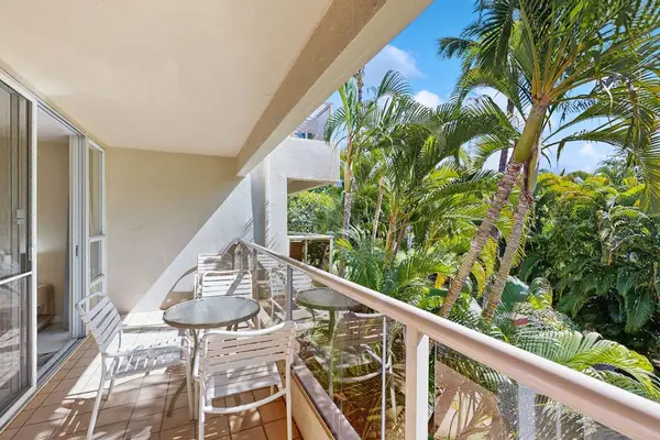 Covered lanai overlooking lush tropical surroundings