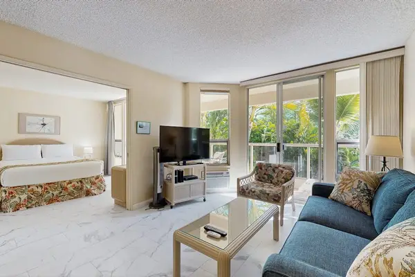 Bright living area with comfortable seating and garden views